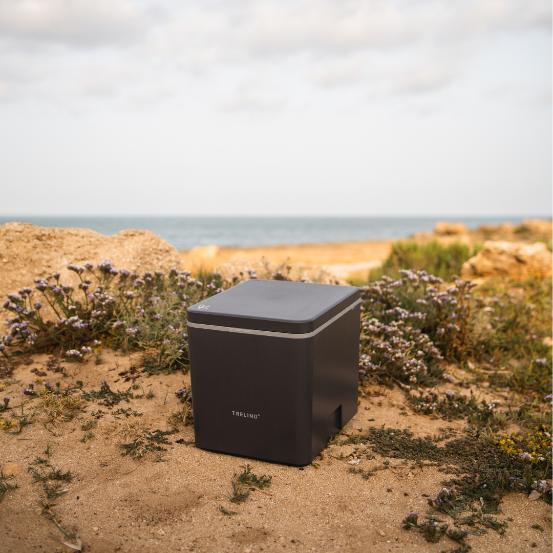 Composting toilet on a secluded beach, surrounded by nature, offering solitude and a peaceful outdoor experience.