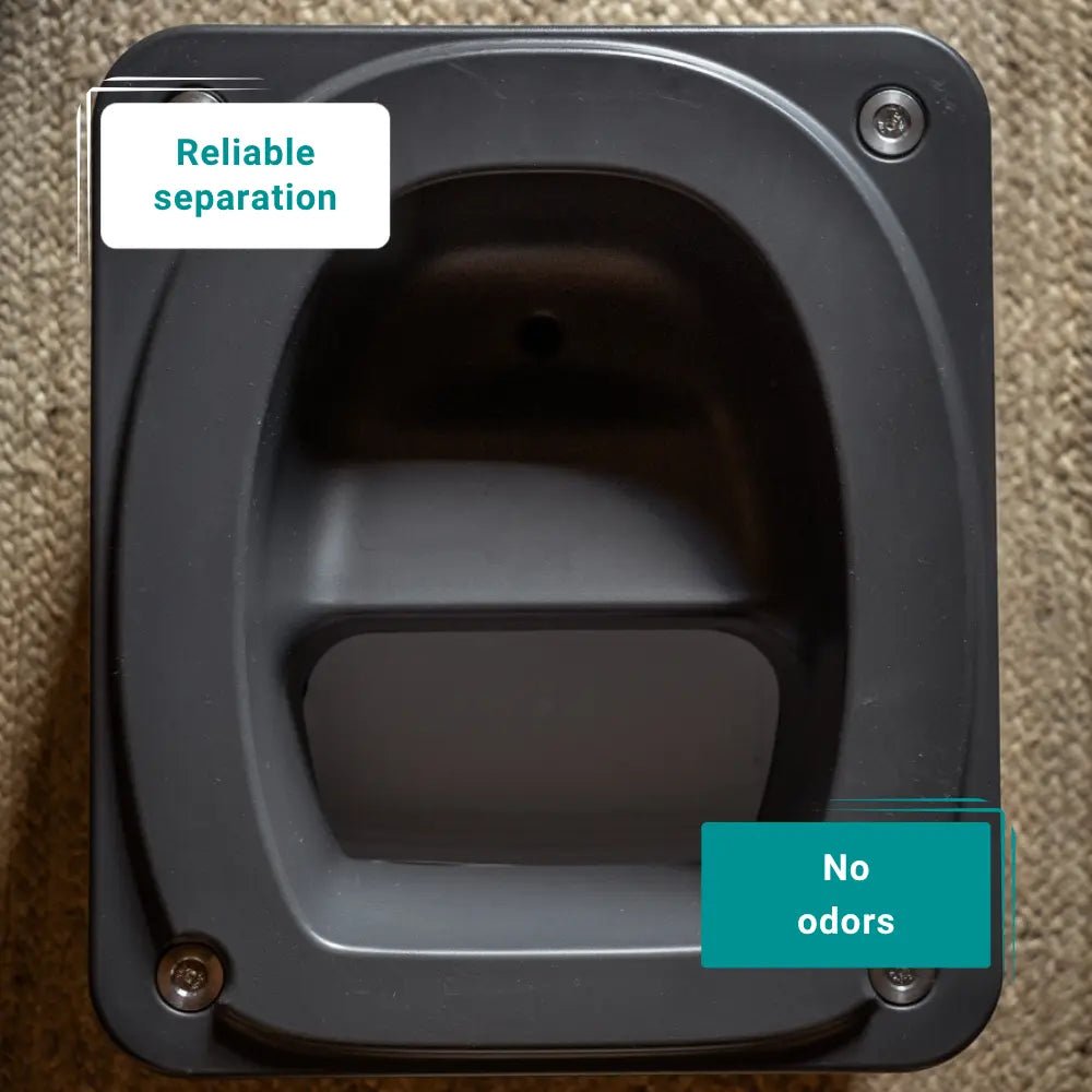 Dark grey travel toilet interior to show how it separates waste.