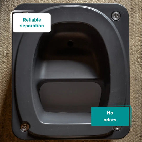 Dark grey travel toilet interior to show how it separates waste.